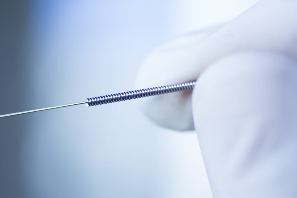 Close-up of a precision medical spring, manufactured by MSP Micro Spring Products in Chennai